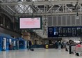 A large screen in the station