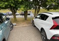 Image of two cars in a car park