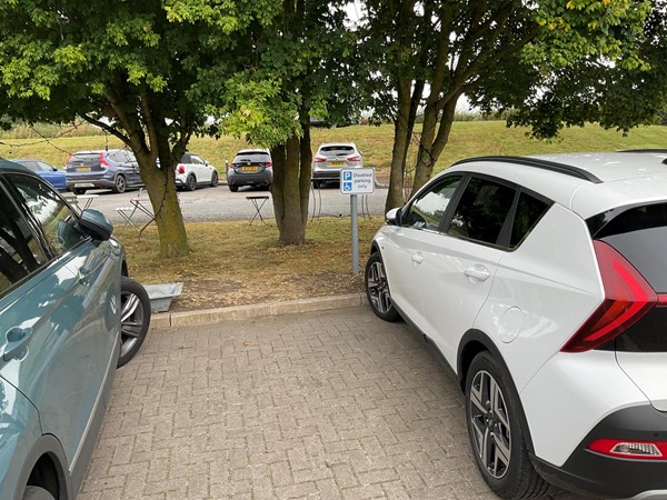 Image of two cars in a car park