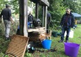 Another image of people in the grounds outside the village hall.