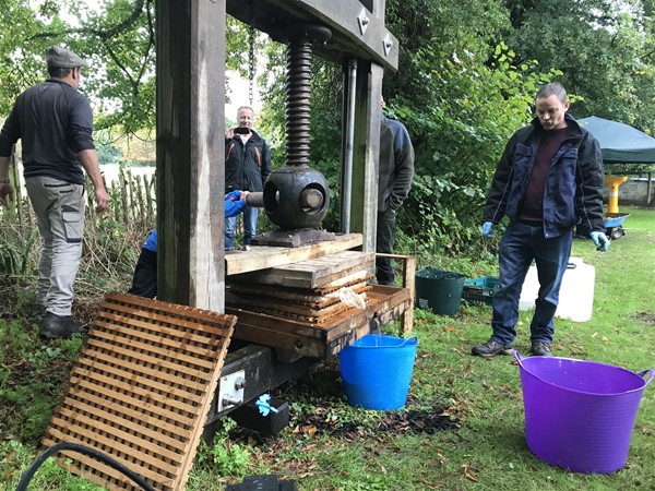 Another image of people in the grounds outside the village hall.