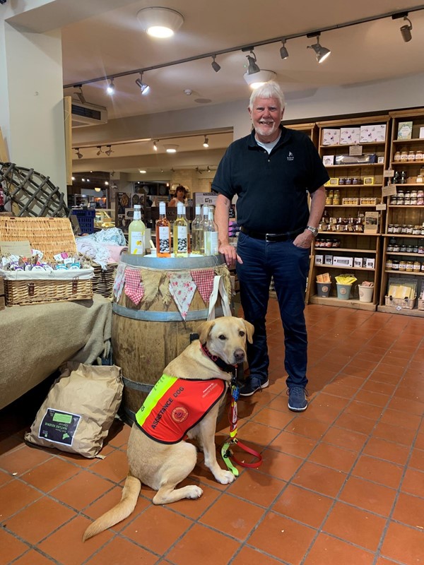 Picture of a man with an assistance dog at Darts Farm