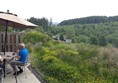 This is the patio at the back overlooking section of forrset. Nice for relaxing if the midges aren't out in force!