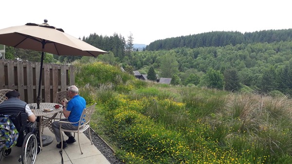 This is the patio at the back overlooking section of forrset. Nice for relaxing if the midges aren't out in force!