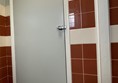 Image of a door in a tiled room