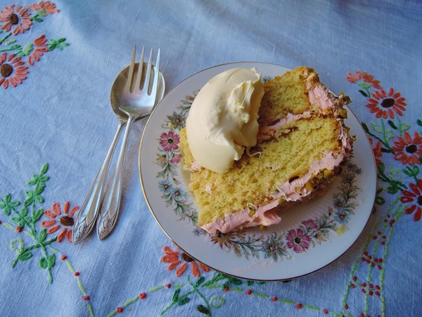 Rose and pistachio cake served with clotted cream