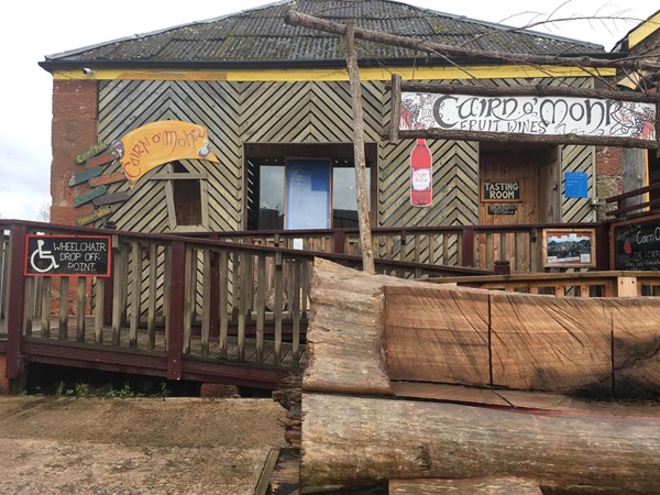 Image of the outside of Cairn O'Mohr showing the ramp going up to the platform and the wheelchair drop off area beside the car park.