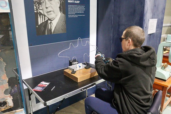 Image of someone doing an electric metal puzzle