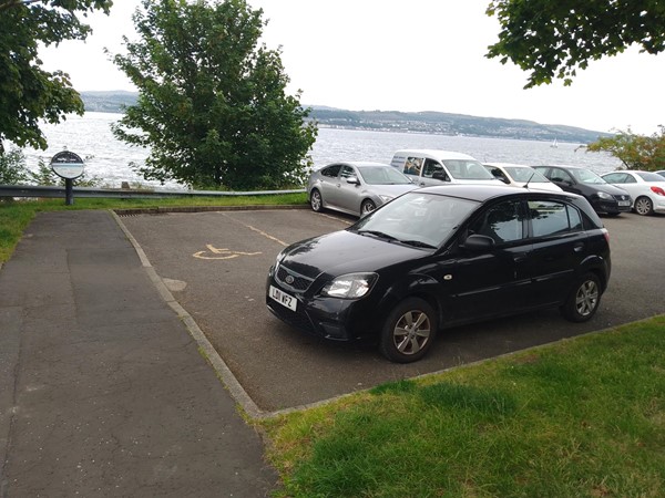 Image of a car parked in a car park