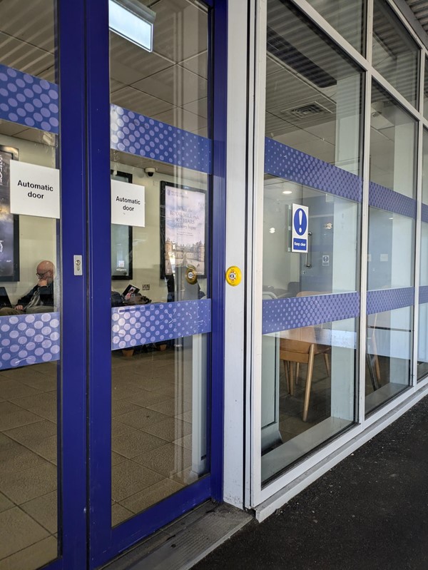 Image of waiting area doors with touch pad