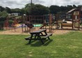 Outside seating and childrens play area - looking towards the pub