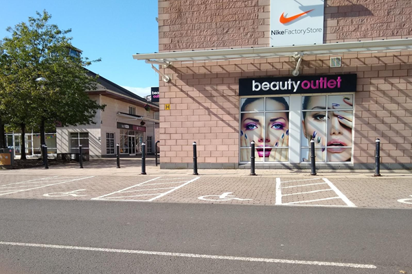 Wide disabled parking spaces next to the shops