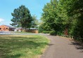 Path to the campsite entrance, with good surface and plenty of space.