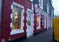 Image of a red building with white trim