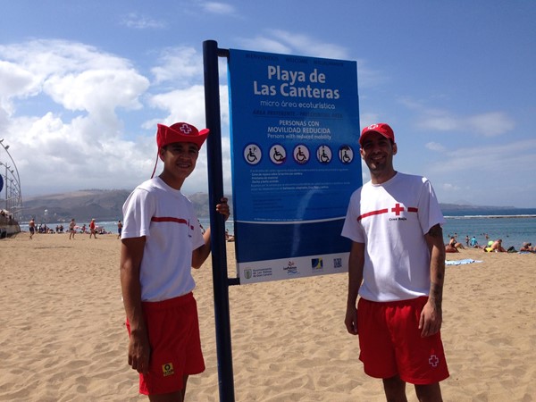 Red Cross assistants on beach