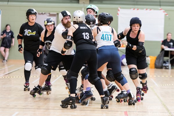 Image of people playing roller derby in the DISC main hall. Photo credit: Laura MacDonald