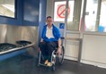 Paul sitting in the dedicated wheelchair space on the Buiksloterweg ferry