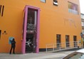 Entrance to the distinctive orange building