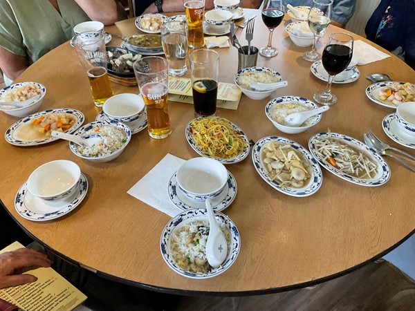 Image of a table with plates of food and glasses