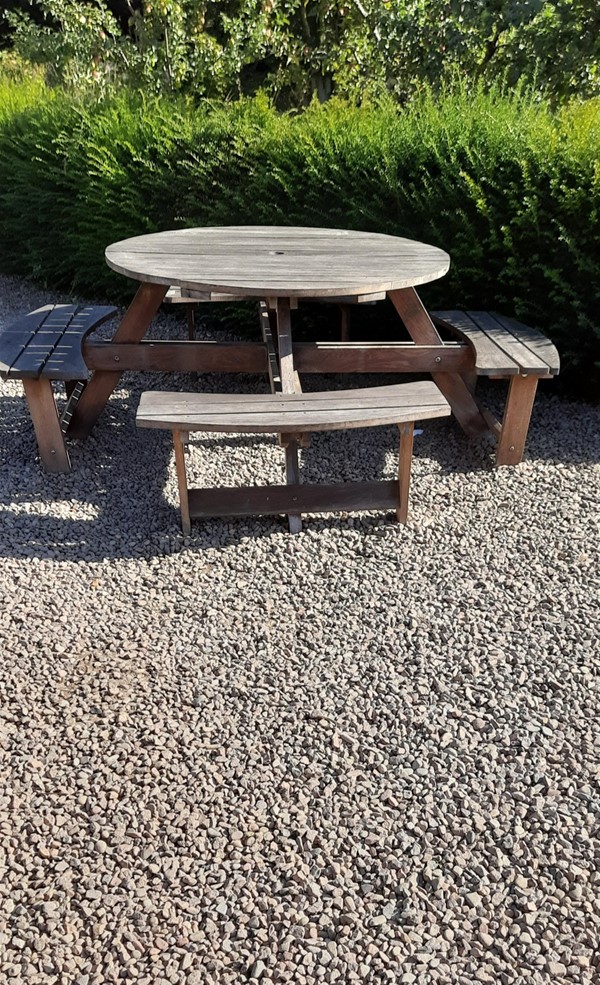 A picnic table in pinewood garden