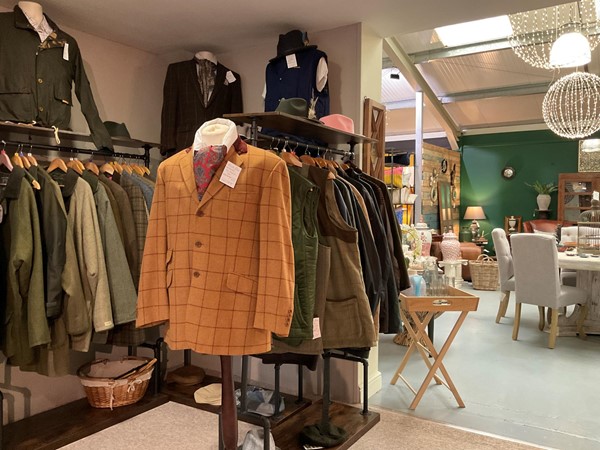 Image of a room with a variety of jackets and coats