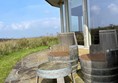 Image of a patio with chairs and a table