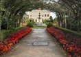 Picture of a garden path going under an archway