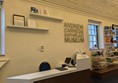 Image of front desk with lowered counter and a hearing loop