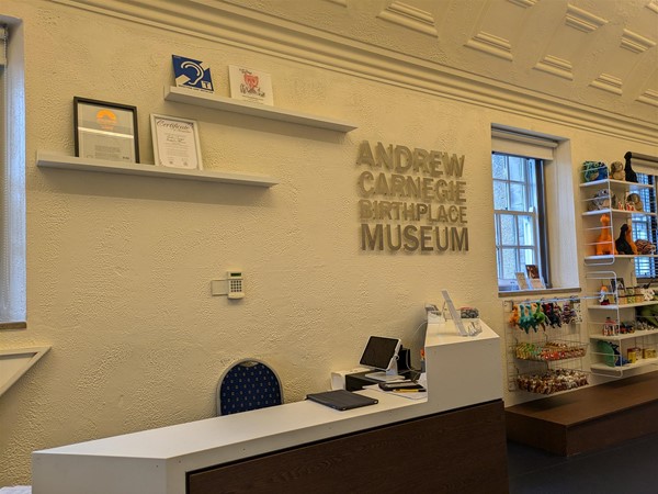 Image of front desk with lowered counter and a hearing loop