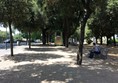 Benches and statues in the park.