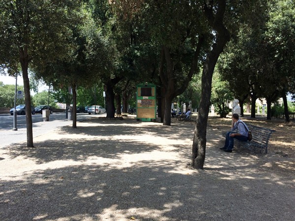 Benches and statues in the park.