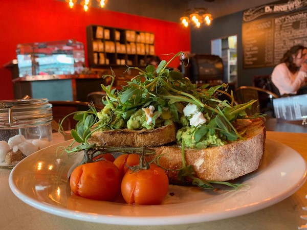 Smashed Avocado and feta on chunky toast with vine tomatoes.  Delicious.