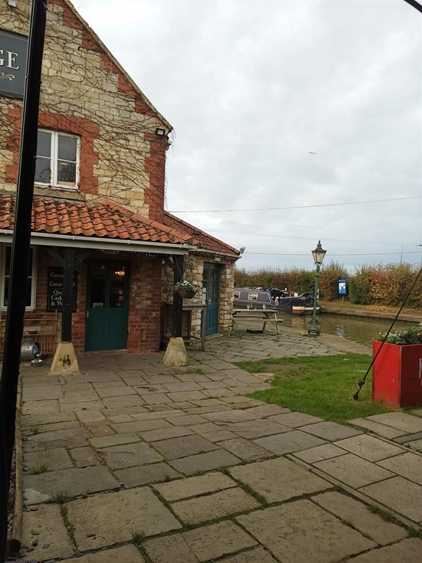 Picture of stone slabs and the back door of a pub