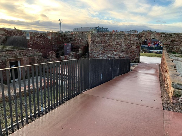 A flat path and railing at the harbour