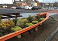 Flowers in a boat by the harbour