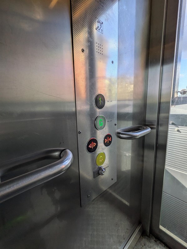 Image of the buttons on the inside of the lift, all have braille markings