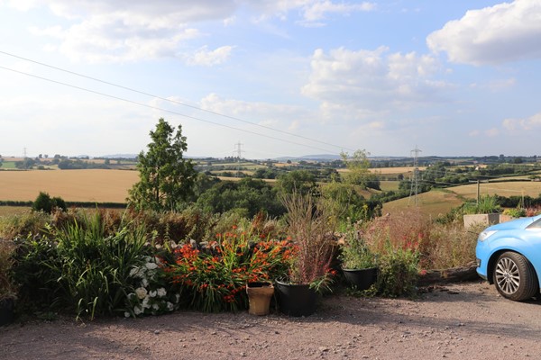 View from front door of cottage and parking area