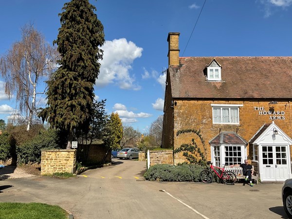 The Howard Arms inn stands on one side of the lovely village green