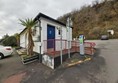 Image of the ramped entrance leading up to the accessible toilet building.