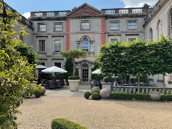 Image of a building with a courtyard and trees