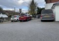 Image of two cars and a van in a carpark