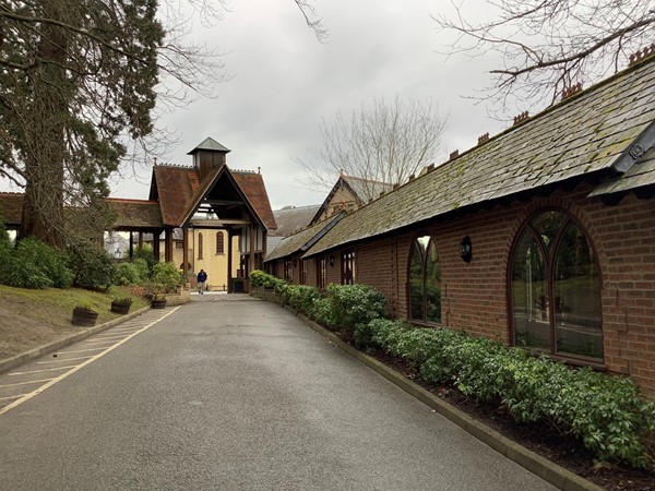 but disabled should drive under the wooden roofed archway that’s ahead of you and continue to the next arch