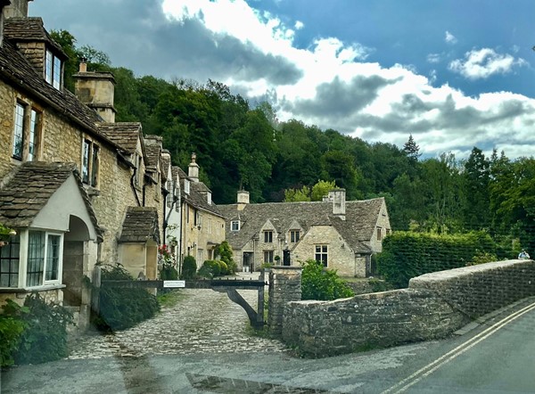 Image of buildings with a street going by