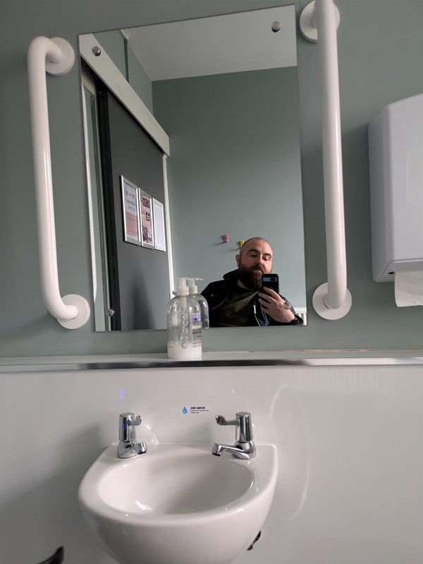 Image of sink and grabrails on both sides in the accessible toilet of Andrew Carnegie Birth Museum