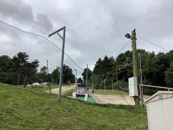 Ski slope behind netting