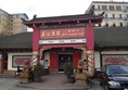 Front entrance to the restaurant, small dropped curb to enter. Double glass doors but they aren't automatic.