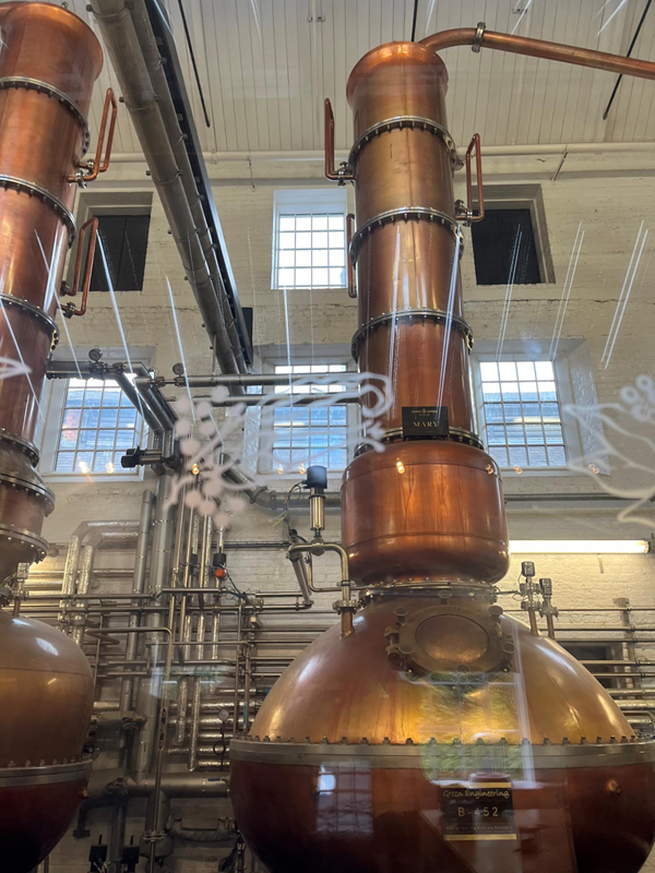 Two of the smaller stills used to create Bombay Sapphire gin.  We went into the room to see them more clearly, but could not take photos in there due to danger of explosions from sparks.  This photo was taken through a glass wall.