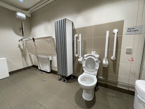 The Changing Places Toilet at the Interchange, Galashiels. Showing the changing bench, hoist, and loo.