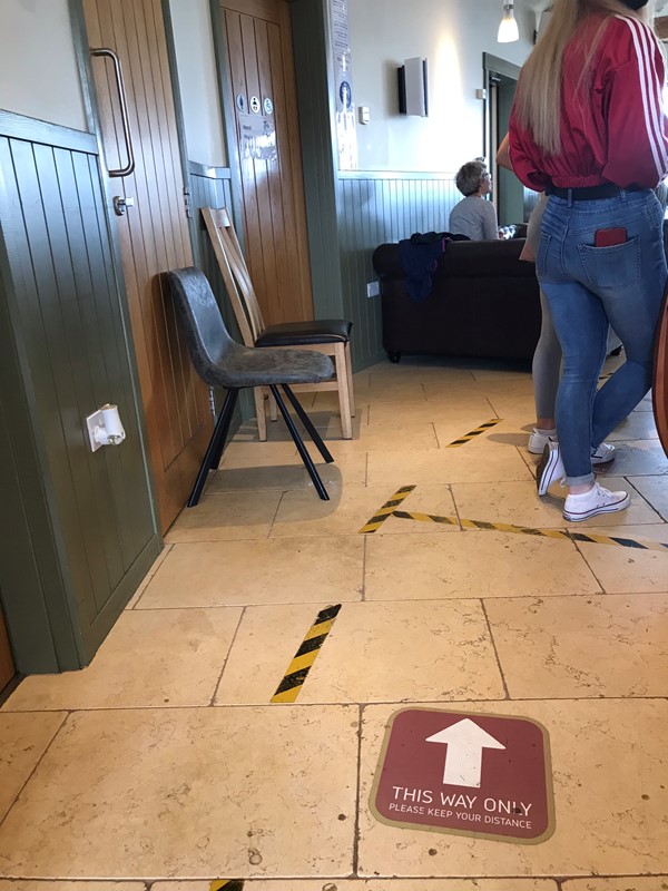 Floor markings on way into building to be shown to your table.