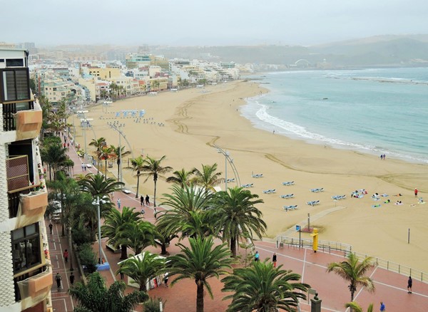 View from roof terrace shows beach and flat walkway